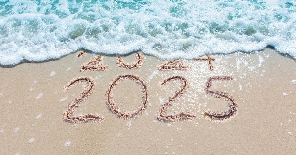 "Ocean wave washing over the year 2024 written in the sand, revealing 2025 underneath."