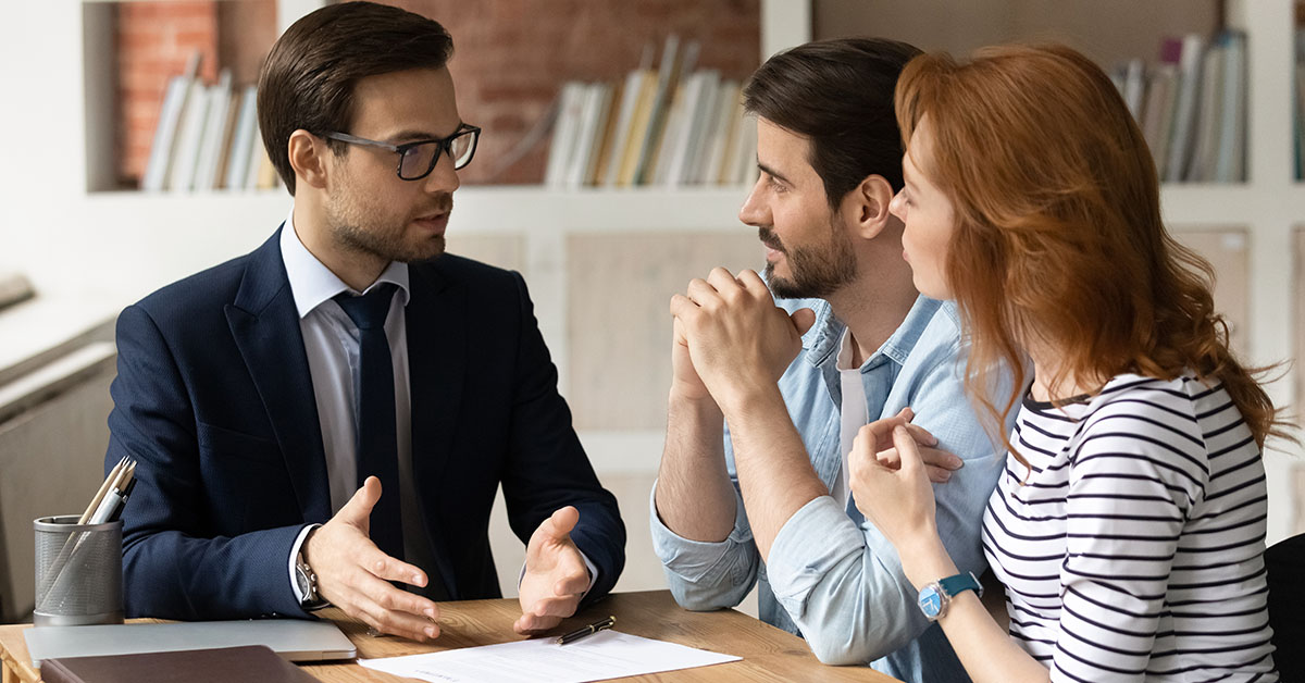 A Family Office Director going over financial resolutions with a couple needing tax and financial planning.